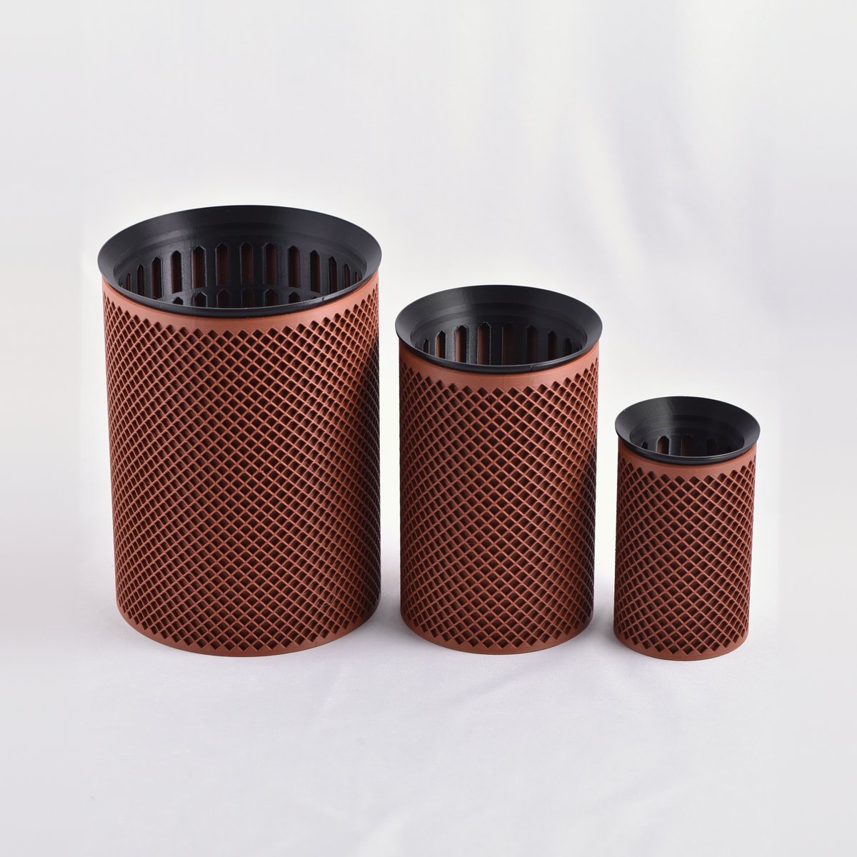 EverRoot 3-Size Bundle in terracotta: Large, Medium and Small assembled in a row, each slotted mesh growing pot seated in its diamond-lattice cachepot